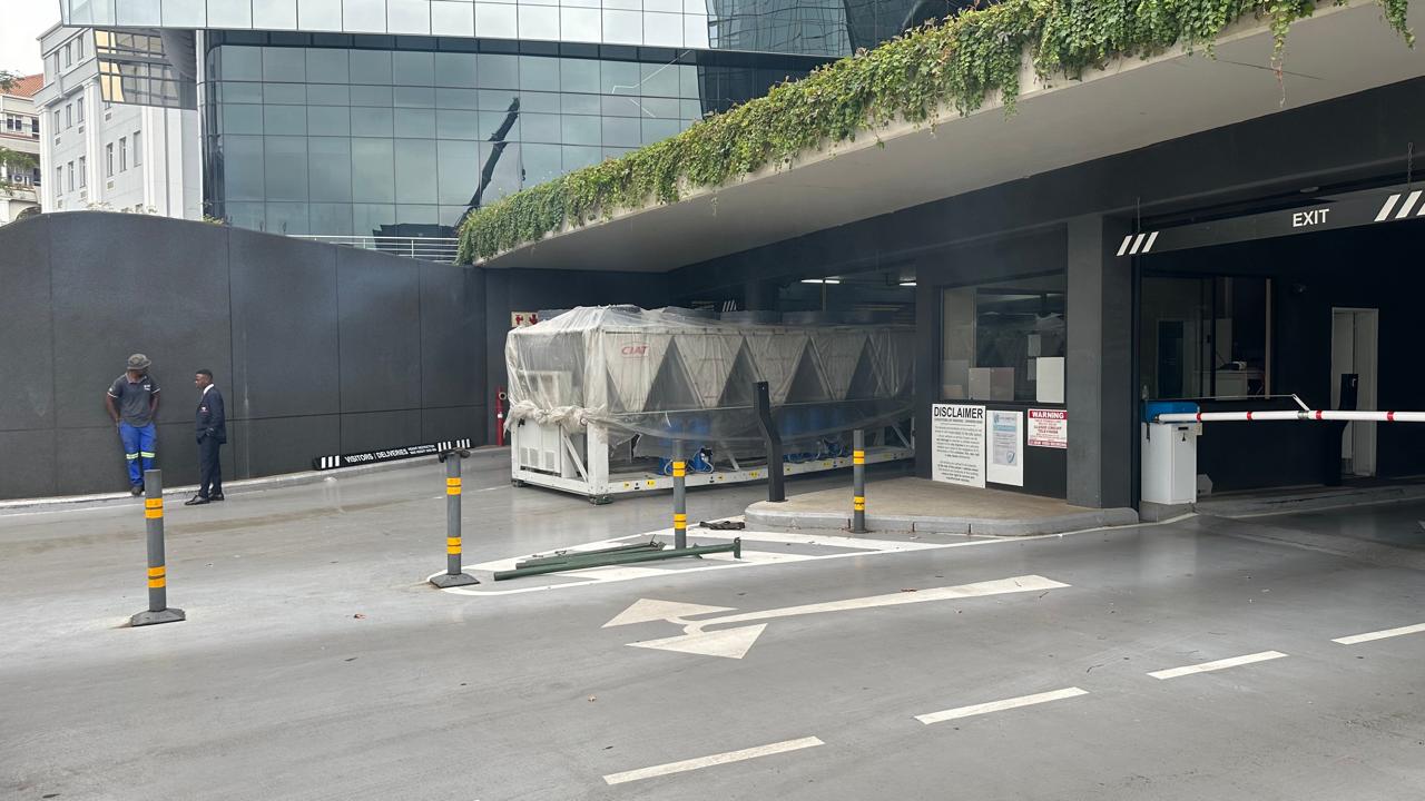New plant unit staged at a building entrance before installation