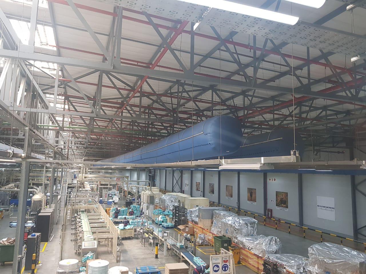 Long run of ducting installed above warehouse racking